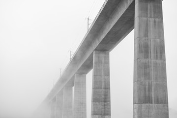 concrete bridge with fog in black and white