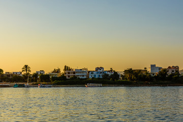 Fototapeta premium Residential buildings on a bank of the Nile river in Luxor, Egypt