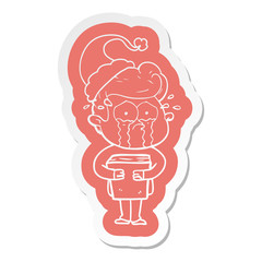 cartoon  sticker of a crying man holding book wearing santa hat