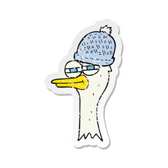 retro distressed sticker of a cartoon bird wearing hat