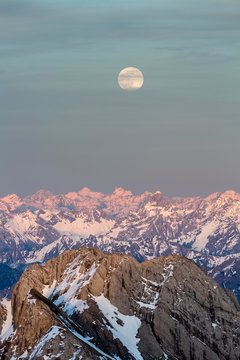 Santis Mountain overlooking Alpstein massif at full moon, Appenzell Alps, Appenzell, Switzerland, Europe