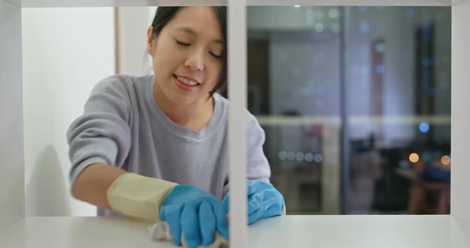 Woman clean the cupboard
