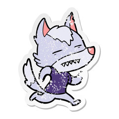 distressed sticker of a cartoon wolf showing teeth