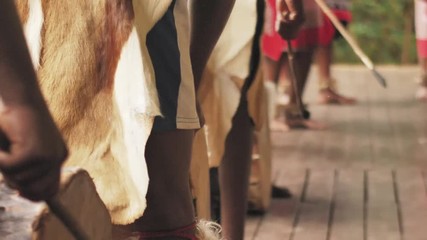 Zulu tribesman hitting traditional drums