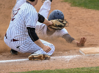 Young athletic boys playing baseball
