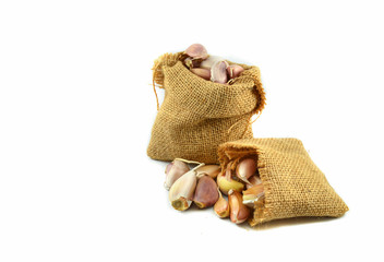 garlic in sack isolated on white background