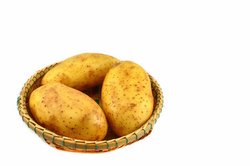 Fresh organic potato in basket isolated on white background
