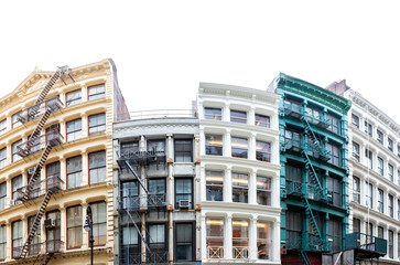 Block of colorful old historic buildings in the SoHo neighborhood in New York City isolated on empty white sky background