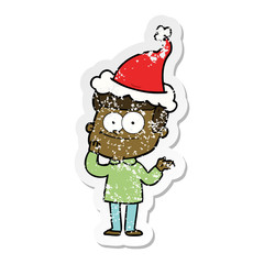 distressed sticker cartoon of a happy man wearing santa hat