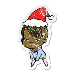 cute distressed sticker cartoon of a girl with hipster haircut wearing santa hat