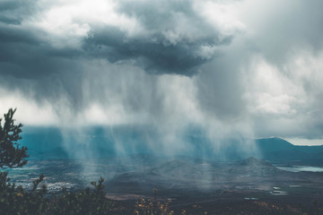 Watching the rain in the city from the mountain