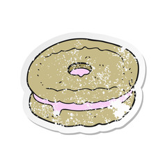 retro distressed sticker of a cartoon biscuit