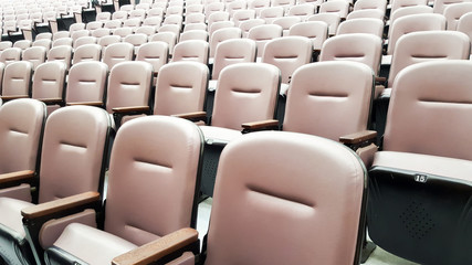 Naklejka premium row of empty chairs, seats in lecture hall