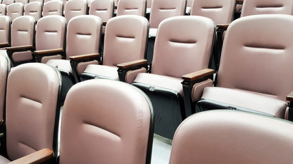 row of empty chairs, seats in lecture hall
