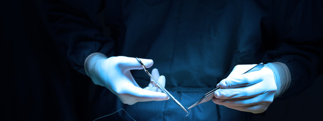 veterinarian surgery in operation room take with art lighting and blue filter - obrazy, fototapety, plakaty