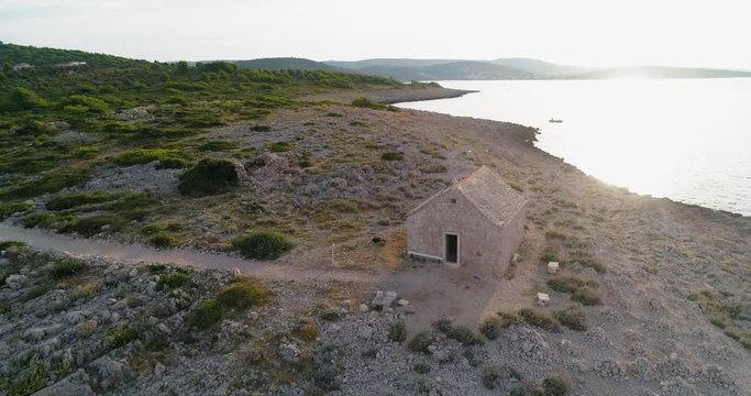 Aerial, pan, drone shot, of a old church, near Razanj town, on the mediterranean shore, the croatian coast, on a sunny, summer day, in Croatia.mp4