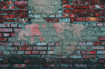 brick wall of old, red, rough brick with shabby white plaster