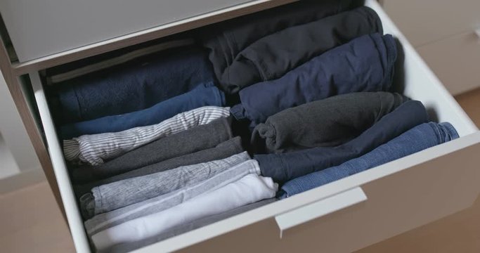 Open the drawer with clothes