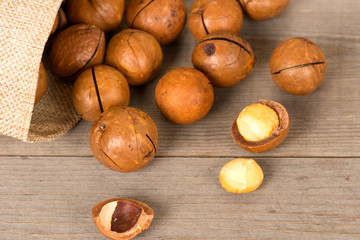 macadamia nuts on wooden background