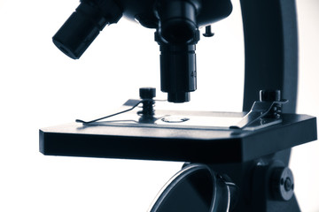 Health analysis Microscope slide under examination. The process of medical research under a microscope