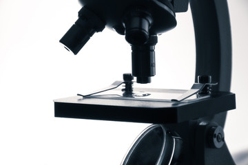Microscope slide under examination. The process of medical research under a microscope