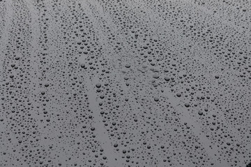 water rain drop on black modern vehicle car with glass coating glossy