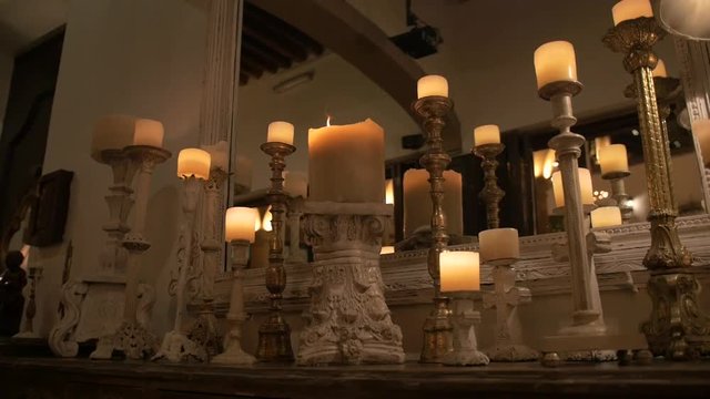 Elegant candles in dimly lit room.