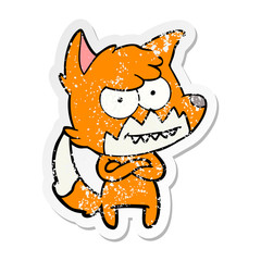 distressed sticker of a cartoon grinning fox