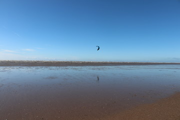 Obraz na płótnie Canvas kite surfing on beach