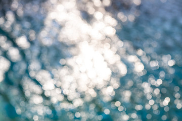 Blurred ripple water in swimming pool, Abstract bokeh background, Sun reflection