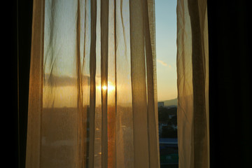 brown curtain closed window in the morning