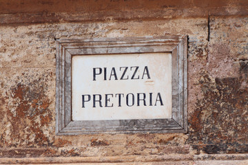 Ancient wall plate with name of city square "Piazza Pretoria". Palermo, Sicily
