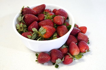 delicious strawberrys freshly cut on granite table