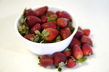 delicious strawberrys freshly cut on granite table