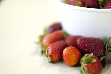 delicious strawberrys freshly cut on granite table