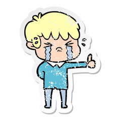 distressed sticker of a cartoon boy crying