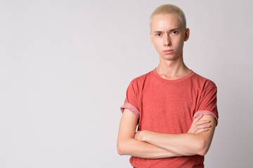 Obraz premium Portrait of young handsome androgynous man with arms crossed