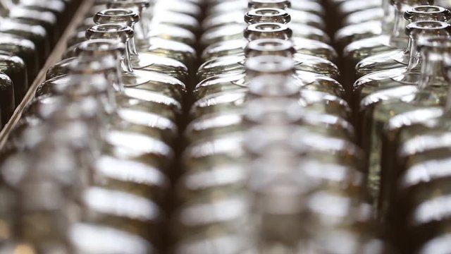 Close up footage of gin being bottled in a craft gin distillery