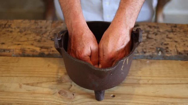 Close up footage of juniper berries being handled in a gin distillery