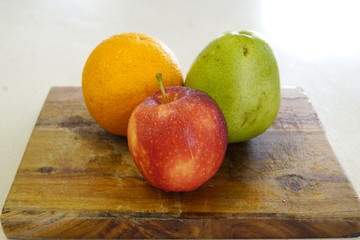 orange pear and apple prepared for a fresh and nutritious salad