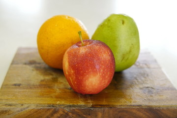 orange pear and apple prepared for a fresh and nutritious salad