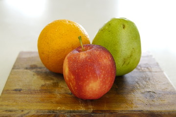 orange pear and apple prepared for a fresh and nutritious salad