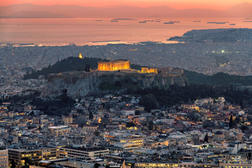 Athens city at sunset from Lycabettus hill with Parthenon Temple at the Acropolis of Athens, Greece.