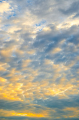 Naklejka na ściany i meble Nice clouds with sunset light effect