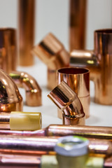 copper pipes of different diameter and sizes and adapters