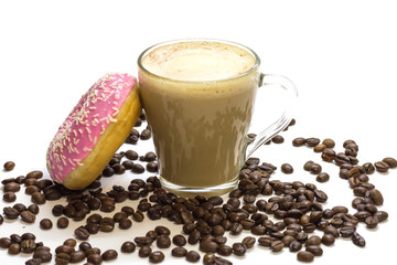 Transparent glass cup with coffee, pink donut and coffee beans on white background. Bright tone, soft focus