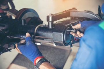 Mechanic Car Service in automotive garage auto car center and vehicles service mechanical engineering. Technician mechanic hands car repairs workshop service center. Services car engine machine.