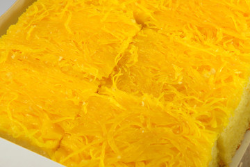 Golden egg yolks threads thai desserts in box background / name in thai Foi Thong
