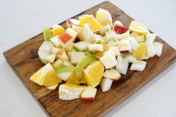 orange pear and apple prepared for a fresh and nutritious salad