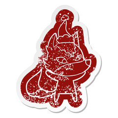 friendly cartoon distressed sticker of a wolf wearing santa hat